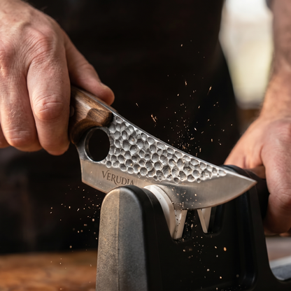 Macro: the hammered Verudia blade passing through the sharpening slot